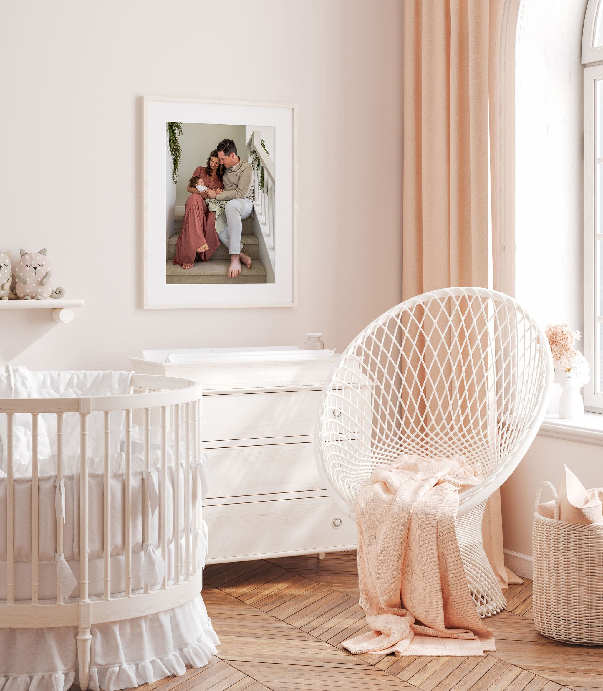 Details of a newborn family portrait hanging in a nursery in boho stylings