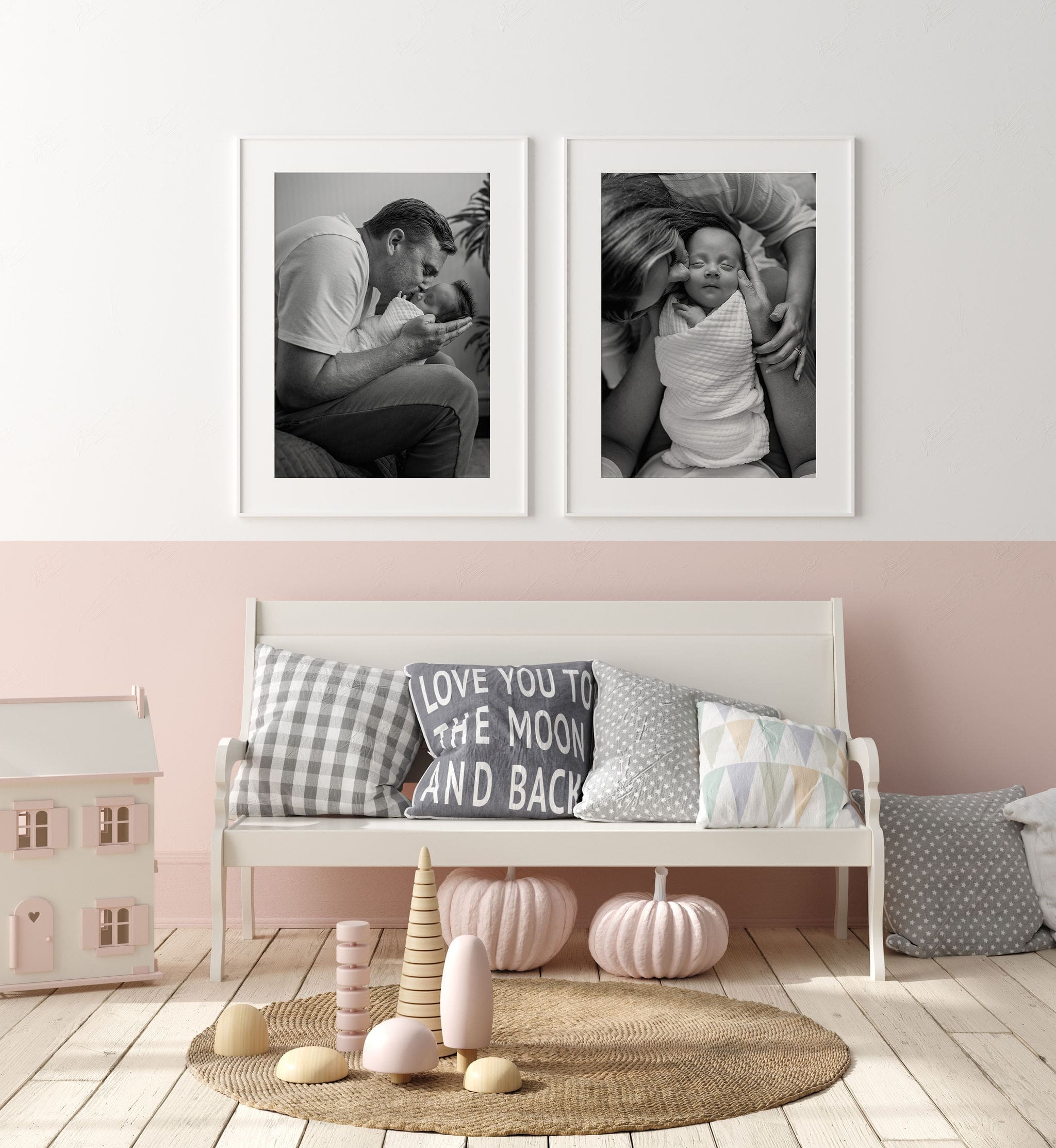 Details of fine art black and white newborn portraits hanging on the wall of a nursery