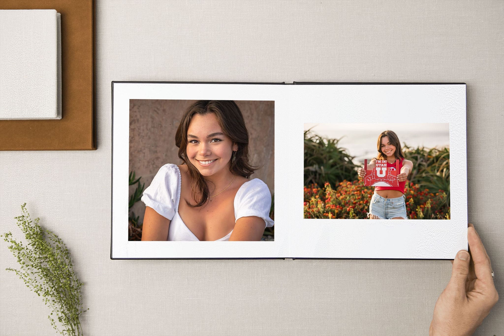 Details of high end art prints of a high school graduate on a table